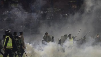 127 killed at Indonesia football match after police fires tear gas at rioting fans