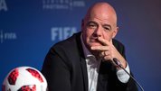 Gianni Infantino shows the red card to blue cards