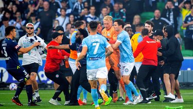 Goalkeeper injured as fans invade pitch in Melbourne derby